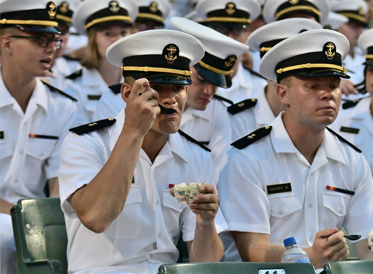 Navy cadets eating ice cream at an event